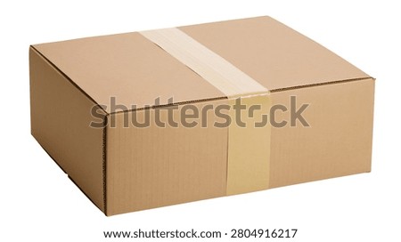 Closed rectangular cardboard shipping box sealed with adhesive tape