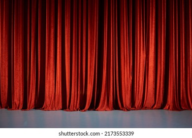 Closed Red Curtains On Stage In Theater