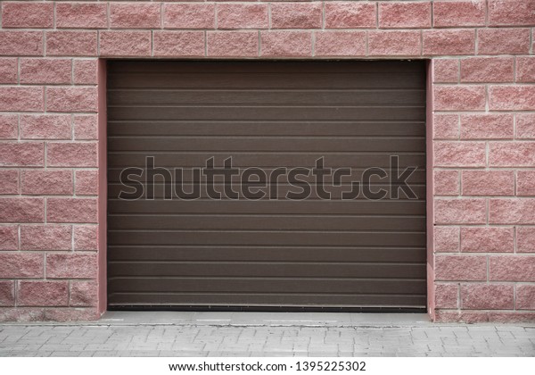 Closed roller\
shutter door of modern\
garage