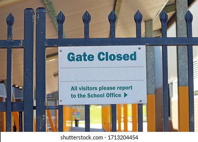 Closed School Gate Sign On A Closed Gate