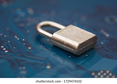 Closed security lock on background blue computer printed circuit board. Cyber Security, virus protection concept