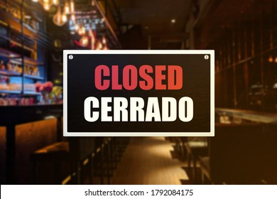 Closed Sign Of A Bar Or Pub. With English And Spanish Translation. Concept Of Closure, Suspension, Or Bankruptcy Of A Bar, Restobar Or Pub.