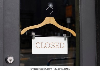 Closed Sign At The Entrance To A Retail Store.