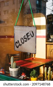 Closed Sign Hanging In Mexican Restaurant Window. Many Shops Remain Empty Due To The Coronavirus Pandemic And The Subsequent Economic Downturn.