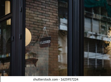  Closed Sign Hanging Outside A Restaurant, Store, Office Or Other