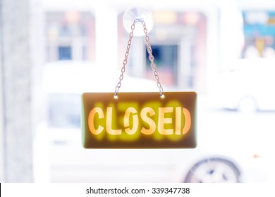 Closed Sign On The Glass Door Of Cafe.