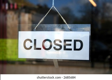 A Closed Sign In A Shop Window.