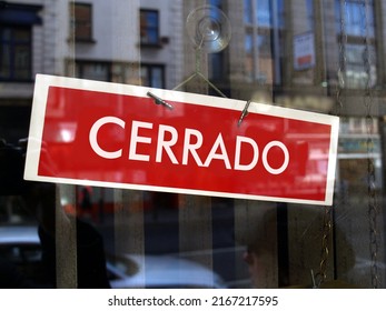 Closed sign in a shop window written in Spanish (translation: Closed) - Shutterstock ID 2167217595