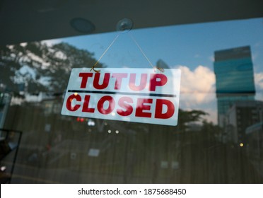 closed sign in the window of a shop, Closed due to Covid-19 - Shutterstock ID 1875688450