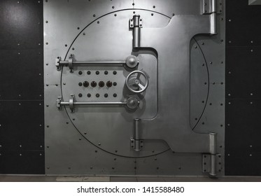 Closed Steel Bank Vault Door, Close-up. Bank Vault. Safe Storage Of Valuables