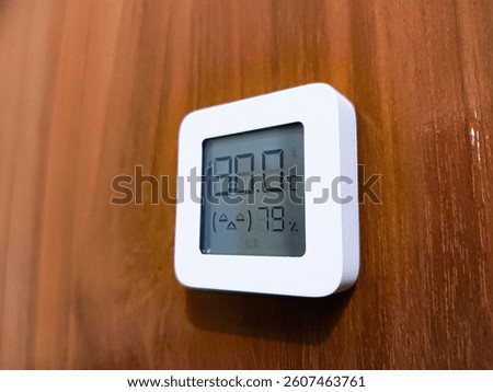 closed up of temperature and hygrometer measuring device indicator for indoor