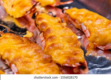 Closed up view grilled cheese tiger prawns. - Shutterstock ID 1556028170