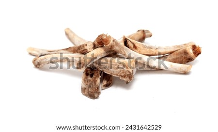 Closed view of a pile of bones after dinner with leftover meat.