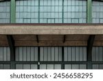 closed warehouse (bleak abandoned concrete and glass building from the 19th century) old train station entrance hanger (windows, steel bars, ledge)