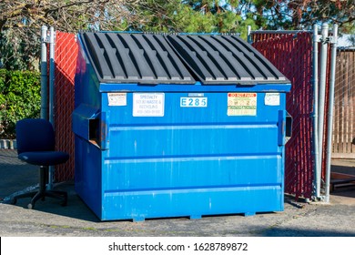 Closed Waste Management Blue Garbage Container Dumpster Used For Commercial And Residential Garbage. Green Trees - Santa Clara, California, USA - 2020