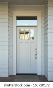 Closed White Front Door Of A House