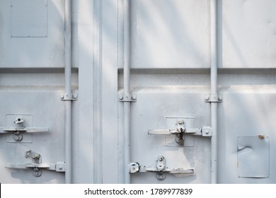 Closed white logistic container cargo door.