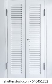 Closed Window With White Wooden Exterior Shutters