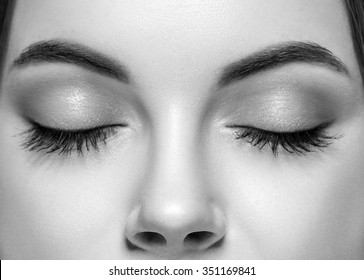 Closed woman eyes nose studio black and white 