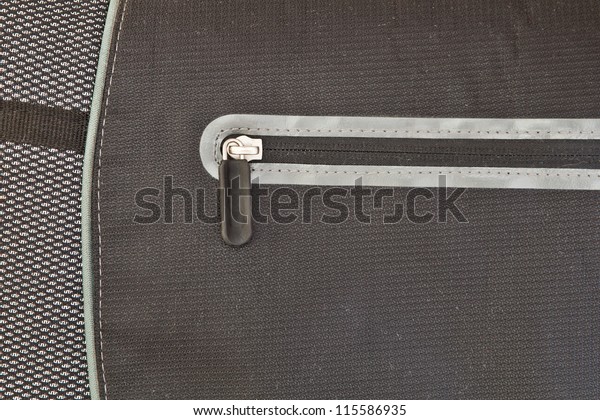 Closed zip on a modern\
nylon laptop bag