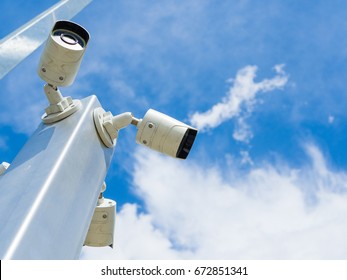Closed-circuit television or CCTV Security camera on blue sky background