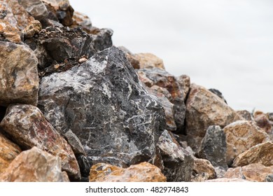 Close-gray granite cubes large stack combined with other pre cloudy backdrop. - Powered by Shutterstock