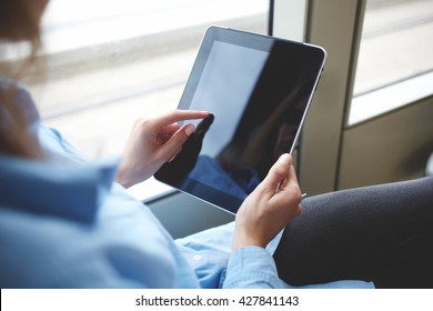 Closely image of woman`s finger is touching touch pad screen with copy space for your advertising text message or promotional content. Close up of hipster girl is downloading file on digital tablet - Powered by Shutterstock