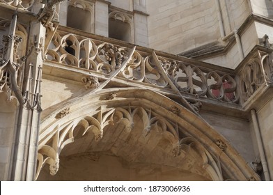 Closer view on a Flamboyant gothic arched gable, topped by a balustrade made of finely worked white stone, on the front of Saint-Pierre-et-Saint-Paul's Cathedral, a gothic landmark in Troyes, France - Shutterstock ID 1873006936