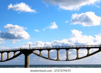 A closer view of the unique architecture and structural lines of Shiosai Bridge under the warm light of a winter afternoon in Shizuoka, Japan.