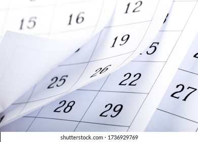 Closes A Calendar Page In Blue. Flipping Calendar 2020