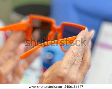 closeu photo of beautiful orange eye glasses frame