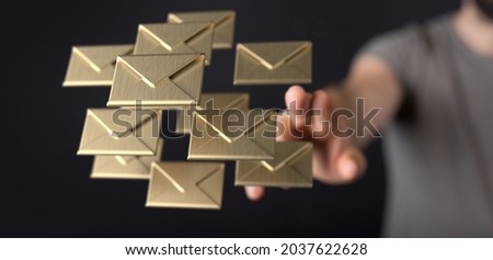 A closeup of 3D rendered golden mail icons in man's hands - Message, Online Chat concept