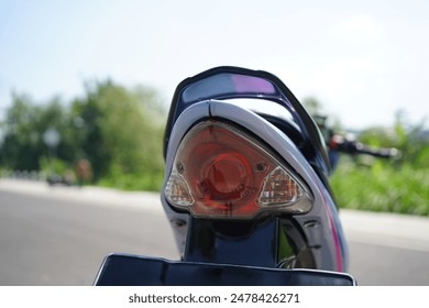 closeup, 4-Stroke underbone motorcycle taillight - Powered by Shutterstock