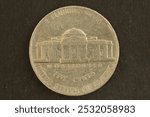 Closeup of a 5 Cents coin of USA depicting D. Jefferson  In God We Trust, Liberty, Monticello.