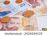 close-up: 50 bulgarian lev banknotes 20 bulgarian levs 2 bulgarian lev coin 50 stotinki coin captured face forward