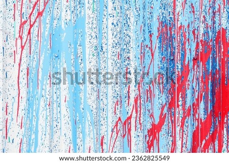 Close-up of abstract dirty corrugated painted metal surface. Red and blue peeling paint texture, background