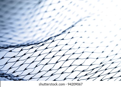 Closeup of abstract fishnet on white background. Blue tone