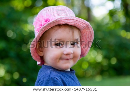 Similar – small girl wearing a hat singing happily