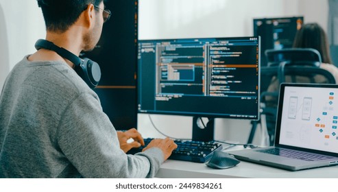 Closeup Adult Asia male, female freelance typing write prompt AI bot IT app smart program nomad, video game, terminal with coding language, user interface, designer, big data center desktop computer.