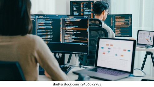 Closeup Adult Asia male, female freelance typing write prompt AI bot IT app smart program nomad, video game, terminal with coding language, user interface, designer, big data center desktop computer.