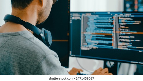 Closeup Adult Asia male, female freelance typing write prompt AI bot IT app smart program nomad, video game, terminal with coding language, user interface, designer, big data center desktop computer. - Powered by Shutterstock