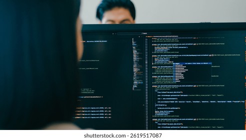 Closeup Adult Asia male, female freelance typing write prompt AI bot IT app smart program nomad, video game, terminal with coding language, user interface, designer, big data center desktop computer.