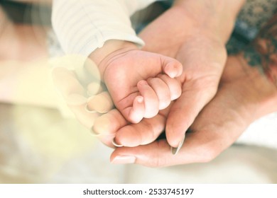 Close-up of adult and baby hands. Tender moment with hands. Baby hand in adult hand. Symbol of care and love. Hands showing connection and warmth. Family and baby moment. - Powered by Shutterstock