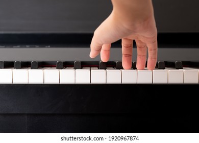 Closeup To Adult Compose Right Hand And Press The Piano Key. Practicing Music Instrument.