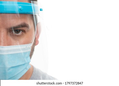 Close-up Of Adult Man Half Face Wearing Transparent Protection Screen Shield And Disposable Surgical Or Medical Mask As Sars Coronavirus Covid19 Influenza Pandemic Prevention Concept