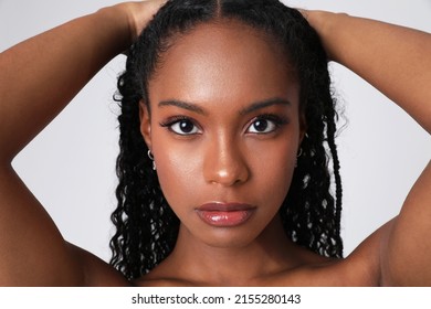 Close-up of African American woman poses indoor. Body and skin care. Isolated.