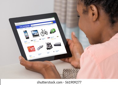 Close-up Of African Woman Doing Online Shopping On Digital Tablet At Home