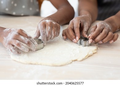 Closeup Of Afro-american Family Mother And Daughter Hands Making Diverse Figures With Cookie Cutters, Black Mom And Kid Baking Together At Home, Using Biscuit Figurines, Baking Concept