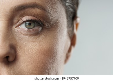 Close-up of aged female eye. Rejuvenation or Ophthalmology concepts.