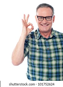 Closeup Of A Aged Man Gesturing An Excellent Job Done Sign. Smiling